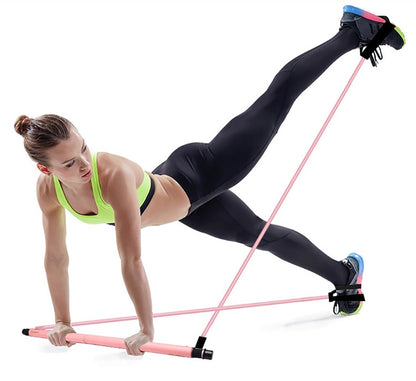 Barra de pilates con bandas elásticas para entrenar en casa